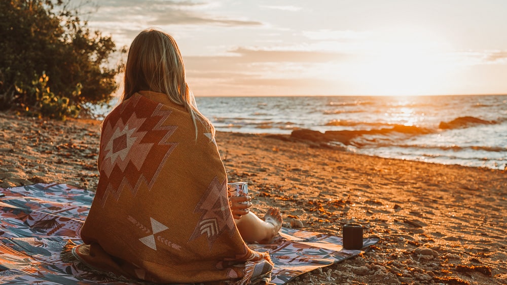 10 Things to do in Hervey Bay when it's not Whale Season 8 Girl watching sunset over the beach