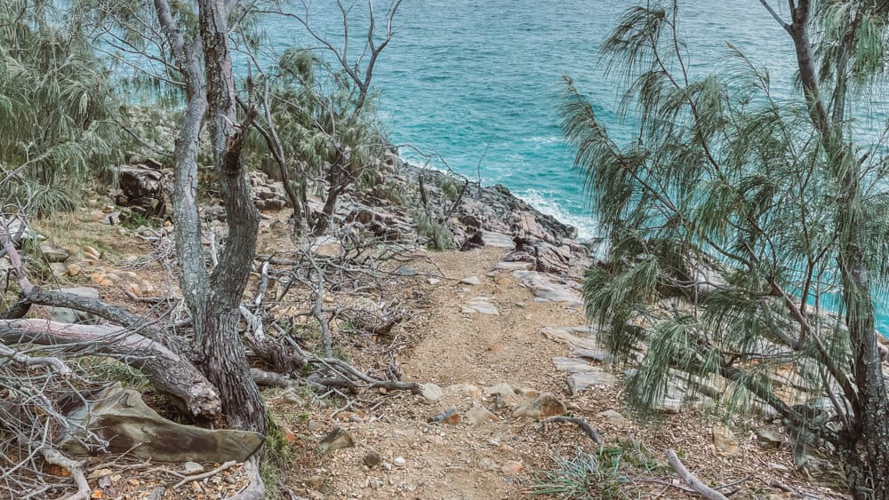 Noosa Fairy Pools - A Guide to Noosa's Hidden Gem 13 Rocky path over the ocean leading to the Noosa Fairy Pools
