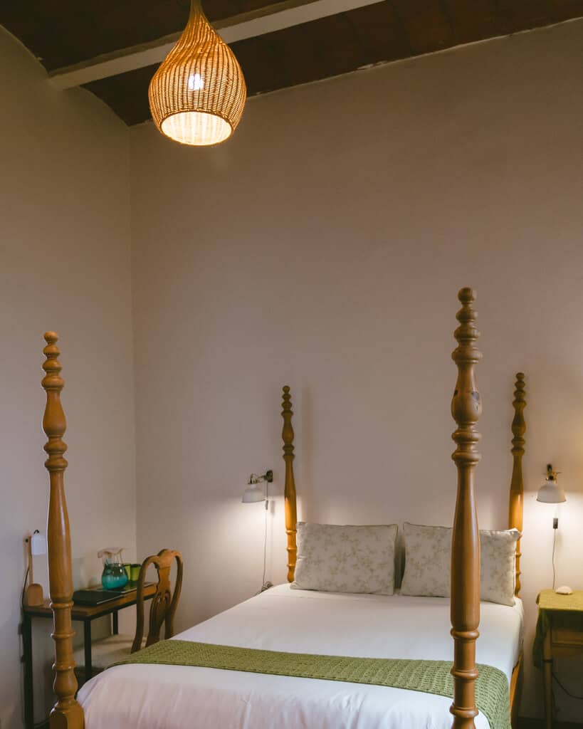 El Patio 77: Sustainable Bed and Breakfast Mexico City 6 A wooden 4 post bed in a hotel room at El Patio 77 a bed and breakfast Mexico City
