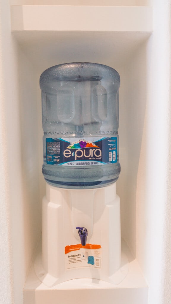 Casa Tortugas Boutique Hotel - Sustainable Accommodation in Cancun 28 A 20 litre water bottle in a dispenser