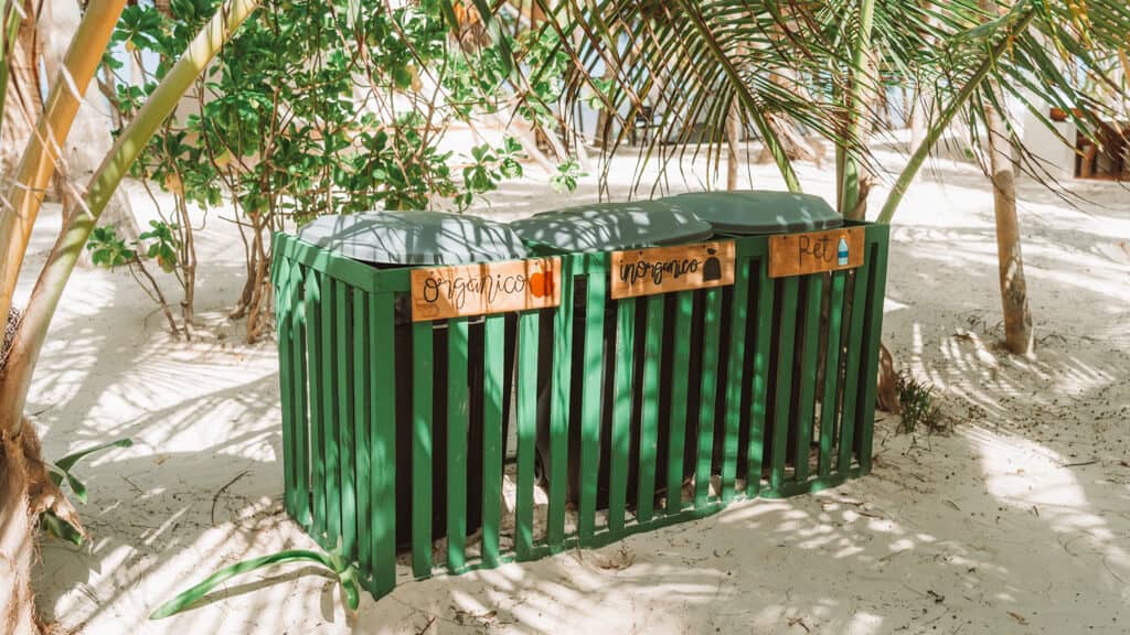 Glamping at Hotel Cielo y Selva in the Sian Ka'an Biosphere Reserve 47 A set of 3 rubbish bins inside a green wooden fence, labelled organico, inorganic and PET
