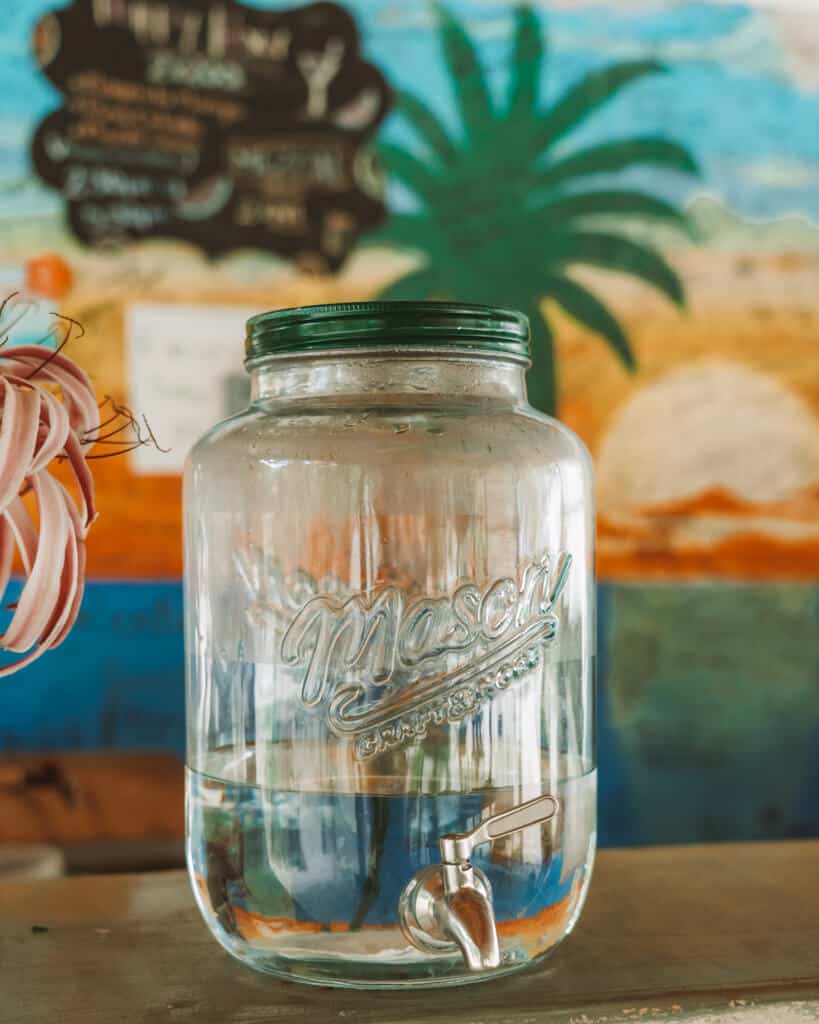 Glamping at Hotel Cielo y Selva in the Sian Ka'an Biosphere Reserve 45 A water dispenser with clean drinking water sitting on a bench