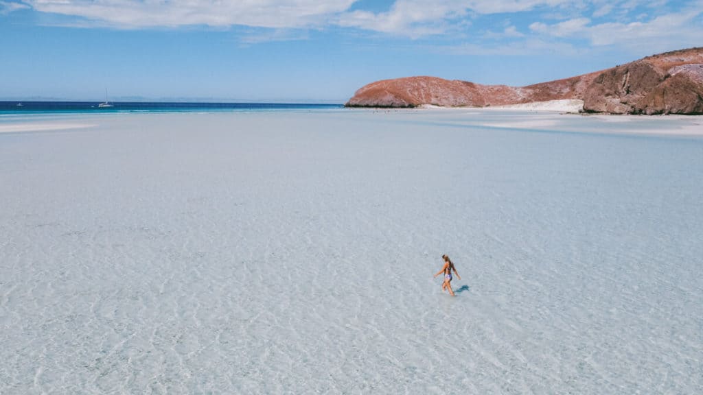 Sally walking through shallow water at Playa Balandra in Baja California Sur