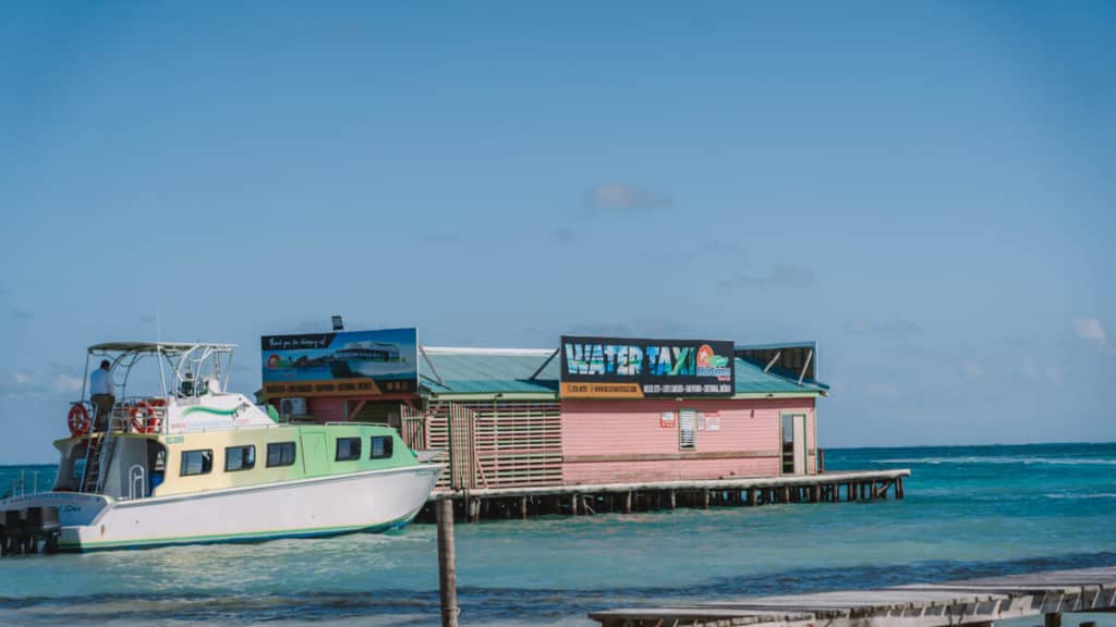 A ferry docked at the water taxi terminal in Caye Caulker
