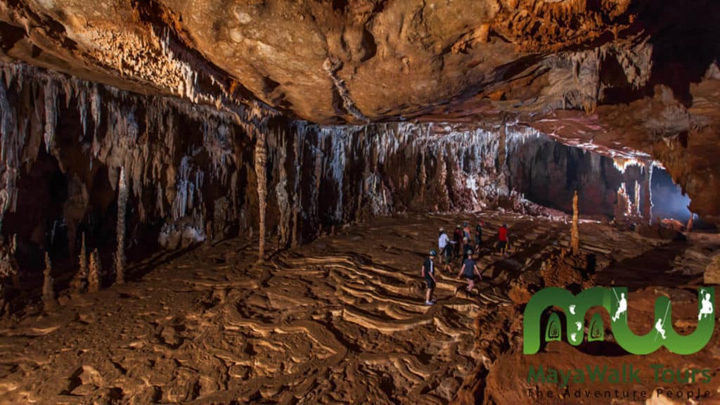 10 Top Things to do in Belize: Your Belize Bucket List 12 Tourists walking inside the vast ATM Cave in Belize