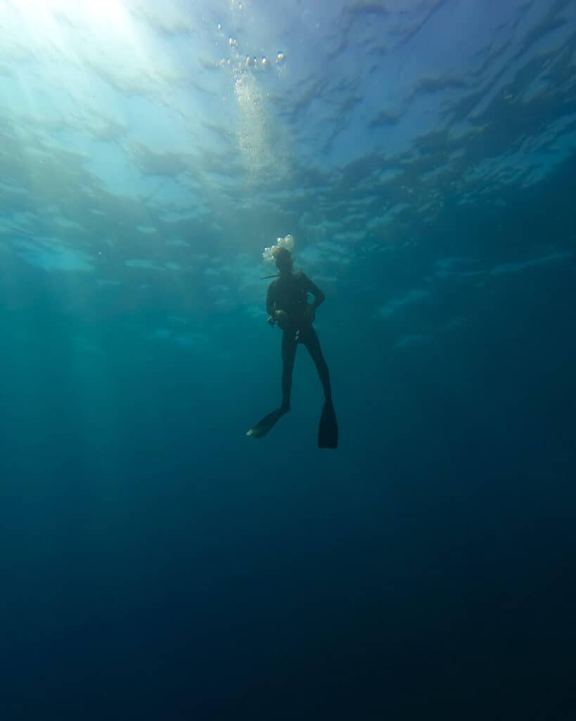 12 Best Things to Do in Drake Bay, Costa Rica 21 Brayden scuba diving, floating in the deep blue water