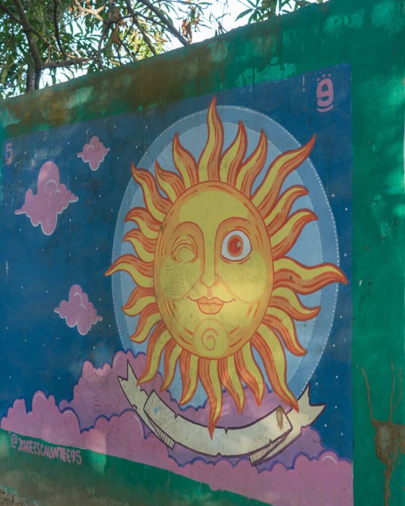 San Pancho Mexico Travel Guide: Tropical Bliss in Nayarit 21 A mural on a wall in San Pancho depicting a sun with a detailed face