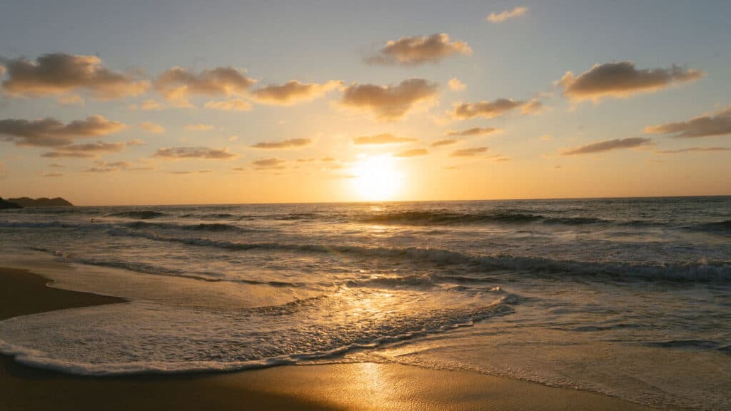 San Pancho Mexico Travel Guide: Tropical Bliss in Nayarit 4 Sunset on the beach in San Pancho, with a very bright sun that hasn't set yet casting beams of light over the water