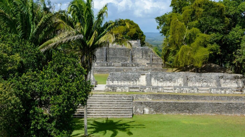 10 Top Things to do in Belize: Your Belize Bucket List 13 Wide view of the Xunantunich Mayan ruins near San Ignacio, Belize, featuring stepped limestone temples and lush jungle trees surrounding the ancient archaeological site.