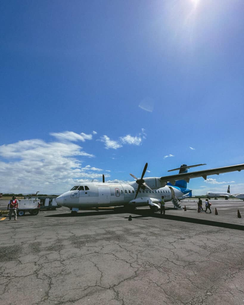 Corn Islands Nicaragua: Paradise on Big & Little Corn 45 A white propeller plane on a sunny day, parked on the tarmac at Big Corn Island airport.