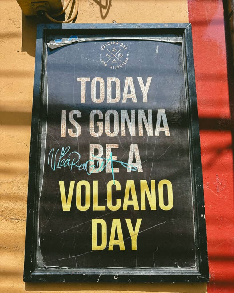Epic Volcano Boarding in Nicaragua at Cerro Negro Volcano 7 A chalkboard sign reads "Today is gonna be a Volcano Day" at the Volcano Day tour office in Leon, Nicaragua.
