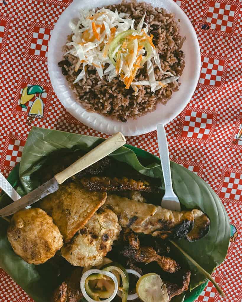 18 Best Things to Do in Leon, Nicaragua 28 A plate of gallo pinto with grilled meats, fried plantains, and fresh salad, served on a banana leaf at a fritanga in León.