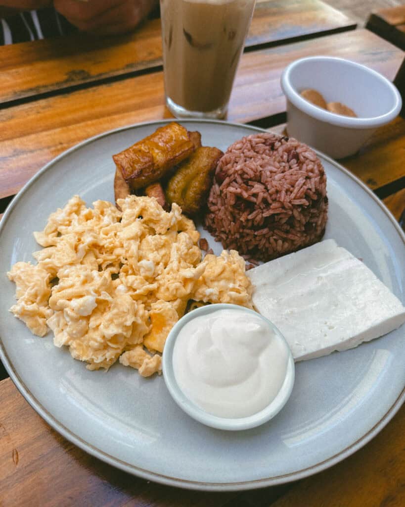 Leon, Nicaragua Travel Guide: The City of Revolution 24 A traditional Nicaraguan breakfast served at Mañana Mañana Café, with gallo pinto, scrambled eggs, fried plantains, cheese, and sour cream.