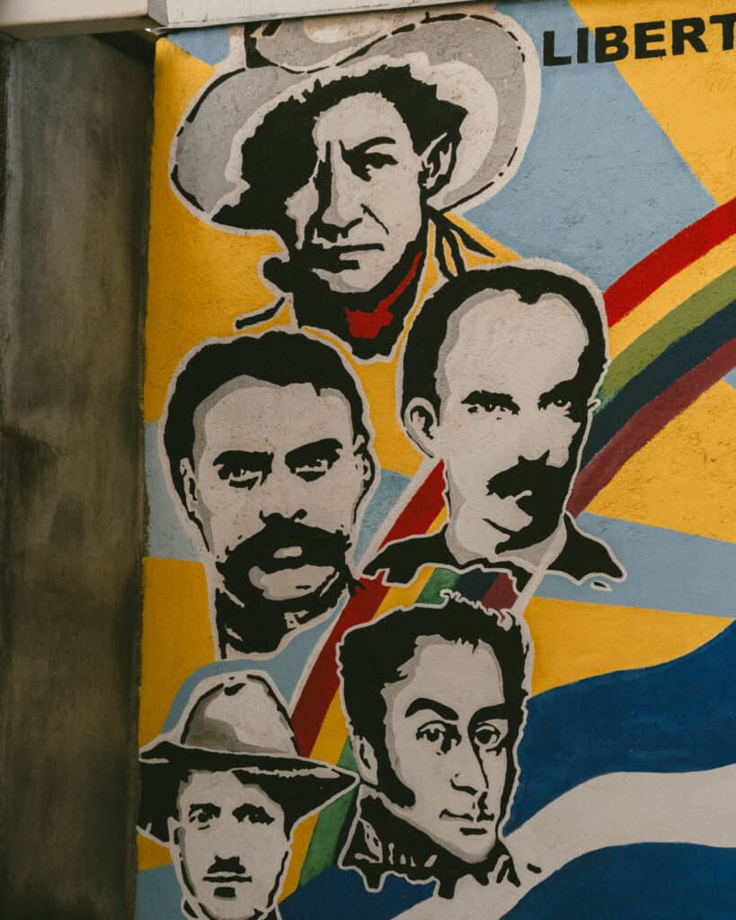 Leon, Nicaragua Travel Guide: The City of Revolution 5 Close-up of historical murals at the Revolution Museum, showcasing iconic Latin American revolutionaries painted in bold colors.