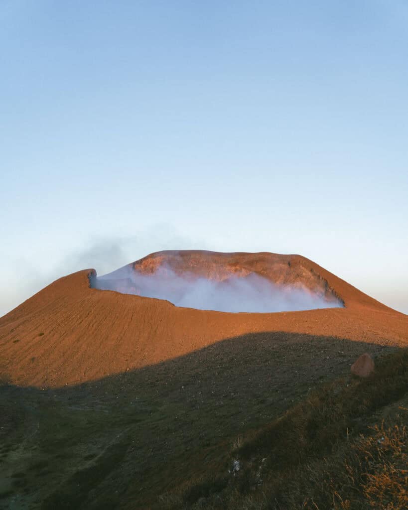 Hiking Telica Volcano in Nicaragua: A Magical Sunrise 3 The smoking crater of the Telica Volcano, illuminated in a soft, morning light.