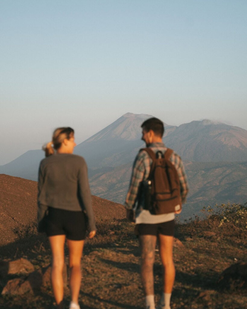 Hiking Telica Volcano in Nicaragua: A Magical Sunrise 1 A close-up of Sally and Brayden sharing a moment at Telica Volcano, smiling with a dramatic volcanic backdrop.