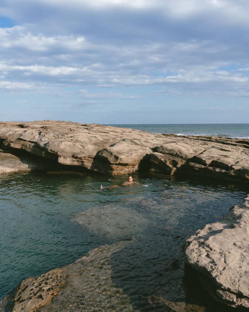Popoyo, Nicaragua Travel Guide: Surf, Sand and Sunsets 23 Brayden swimming in a tidal pool with rocky formations in Guasacate, near Popoyo, Nicaragua.