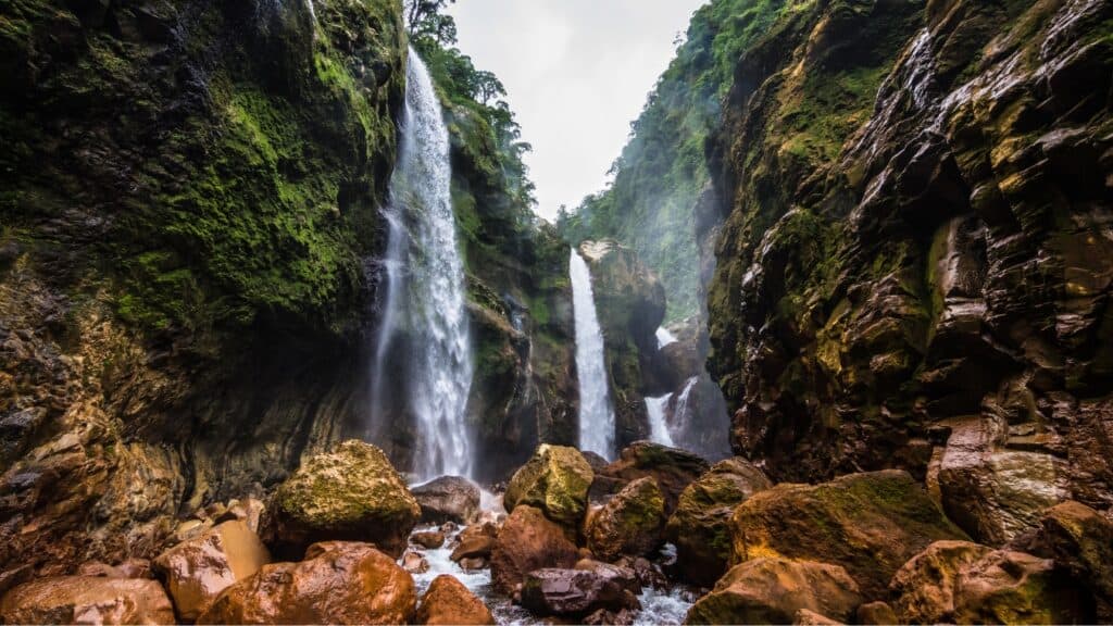 Bajos del Toro Travel Guide: Costa Rica's Waterfall Wonderland 13 A wide shot of Quebrada Gata, a series of waterfalls in a narrow river canyon in Bajos del Toro.