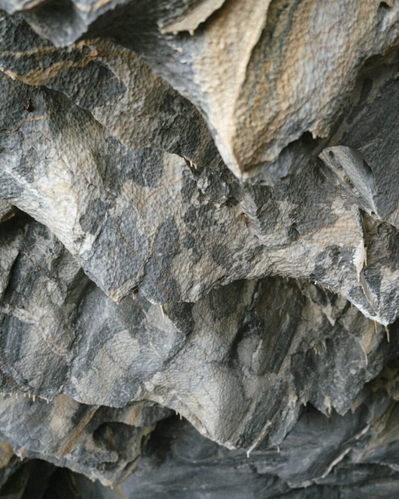 How to Visit the Marble Caves in Chile: Worth the Journey? 23 A detailed look at the rugged, serrated edges of marble rock inside the caves near Puerto Río Tranquilo, highlighting weathered layers and cracks