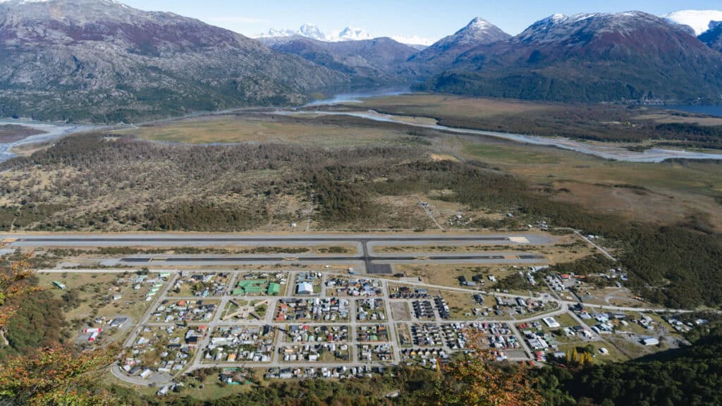 Villa O'Higgins, Chile Guide: End of the Carretera Austral 20 Panoramic view over Villa O'Higgins and its small airport, framed by sprawling wetlands, river systems, and the dramatic peaks of the Southern Andes in Patagonia