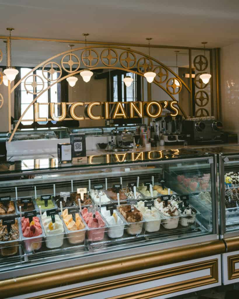 Buenos Aires Food Tour: Sherpa Food Tours in San Telmo 2 Inside Lucciano’s gelato shop, a large gold-arched mirror reflects pendant lights above a gleaming gelato counter filled with a rainbow of flavors, including fruit sorbets and chocolate varieties.
