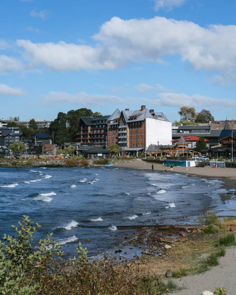 The Carretera Austral, Chile: Everything You Need to Know 20 A shot of the Puerto Varas waterfront, with the choppy waters of Lago Llanquihue crashing on the shore, with the malecon path and buildings in the background.