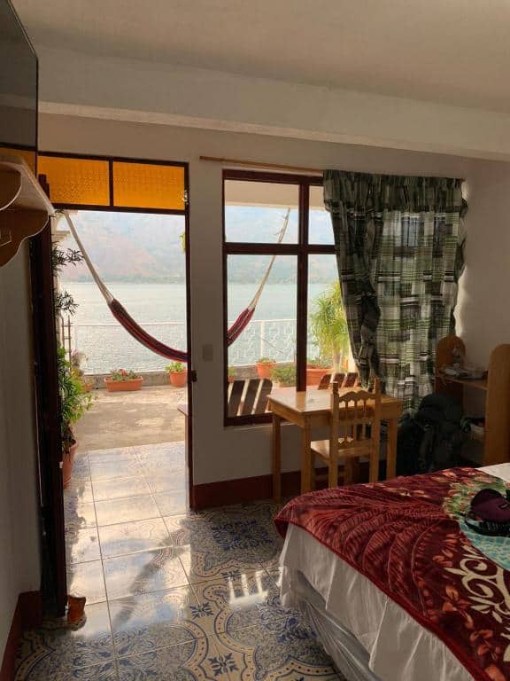Lake Atitlan Travel Guide: Everything You Need to Know 19 Cozy room with a hammock on the terrace overlooking Lake Atitlán at Villa del Lago in San Pedro La Laguna, Guatemala.